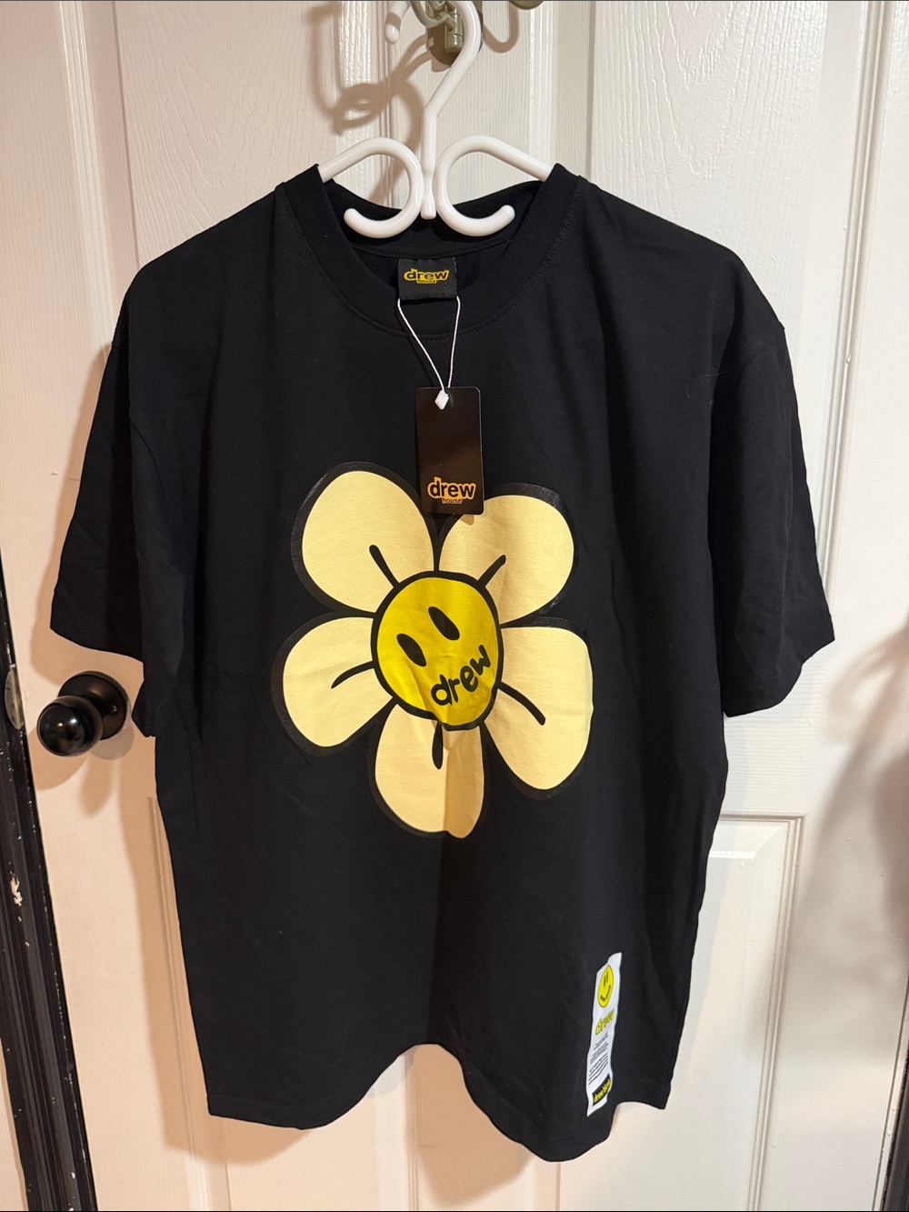 drew house Black Tee with Yellow Smiley Daisy Graphic